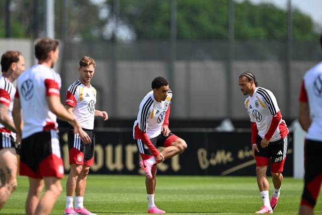 30 May 2026, Bavaria, Herzogenaurach: Germany players Joshua Kimmich, Jamal Musiala, and Leroy Sane take part in a training session ahead of Sunday's international friendly against Finland. Photo: Federico Gambarini/dpa - IMPORTANT NOTE: In accordance with the regulations of the DFL German Football League and the DFB German Football Association, it is prohibited to utilize or have utilized photographs taken in the stadium and/or of the match in the form of sequential images and/or video-like photo series.