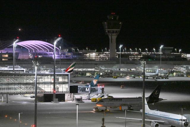 FILED - 25 April 2026, Bavaria, Munich: FILE PHOTO - Aircraft parked at night at Munich Airport. Photo: Felix Hörhager/dpa
