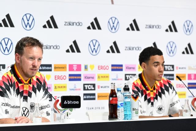 30 May 2026, Bavaria, Herzogenaurach: Germany head coach Julian Nagelsmann and player Jamal Musiala speak during a press conference ahead of Sunday's international friendly against Finland. Photo: Federico Gambarini/dpa - IMPORTANT NOTE: In accordance with the regulations of the DFL German Football League and the DFB German Football Association, it is prohibited to utilize or have utilized photographs taken in the stadium and/or of the match in the form of sequential images and/or video-like photo series.