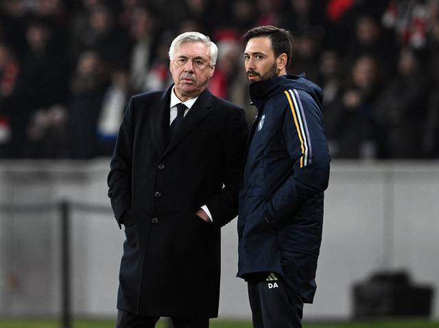 FILED - 12 December 2023, Berlin: FILE PHOTO - Real Madrid coach Carlo Ancelotti (L) and Davide Ancelotti talk during the 2023 UEFA Champions League Group C soccer match between 1. FC Union Berlin and Real Madrid at the Olympiastadion. Davide Ancelotti is following in the footsteps of his famous father, Carlo Ancelotti, and has taken a first head coach job in Europe at Ligue 1 side Lille. Photo: Soeren Stache/dpa