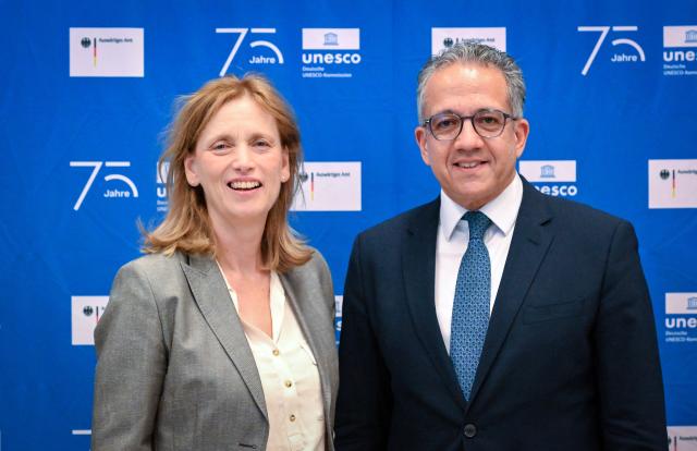 02 June 2026, Berlin: German Minister for Education, Family Affairs, Senior Citizens, Women, and Youth Karin Prien (L) and UNESCO Director-General Khaled El-Enany stand in the James Simon Gallery before the start of the commemorative event "With UNESCO for Peace: 75 Years of Commitment". Germany became a member of UNESCO 75 years ago. Photo: Soeren Stache/dpa