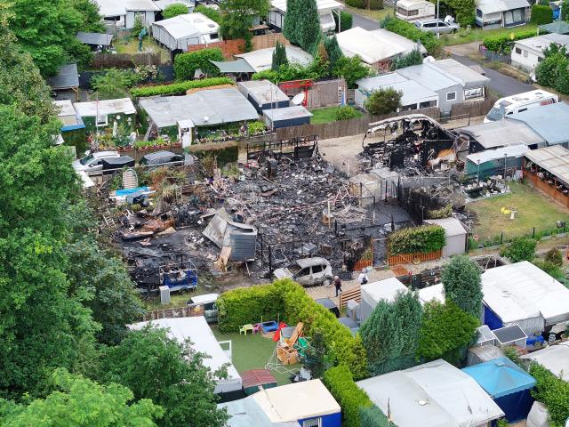 03 June 2026, North Rhine-Westphalia, Niederkrüchten: An aerial drone view shows the widespread destruction at a campsite near Oberhof, following a massive overnight fire. The late-evening blaze destroyed multiple caravans and wooden cabins before more than 100 firefighters brought it under control. Photo: --/dpa