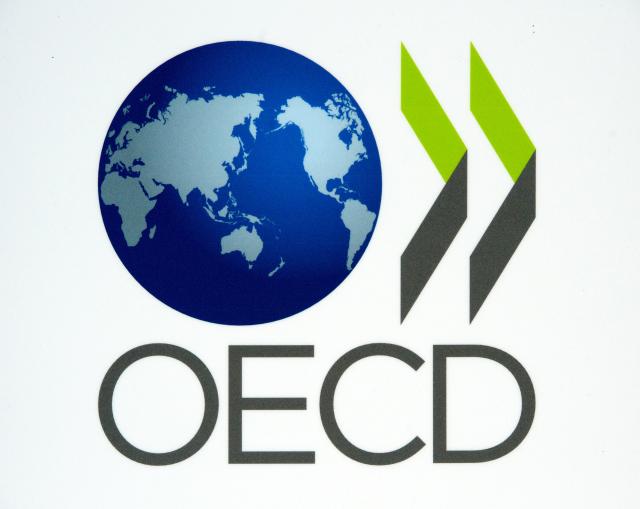 FILED - 25 May 2011, Leipzig: FILE PHOTO - The logo of the Organisation for Economic Co-operation and Development OECD. Photo: Peter Endig/dpa-Zentralbild/dpa