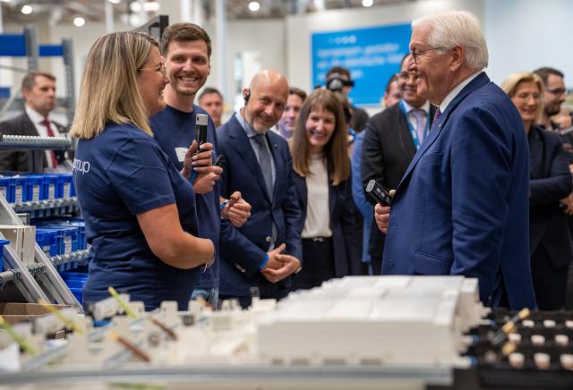 03 June 2026, Saarland, ---: German President Frank-Walter (r) talks to employees in final assembly during a visit to Hager. Photo: Harald Tittel/dpa