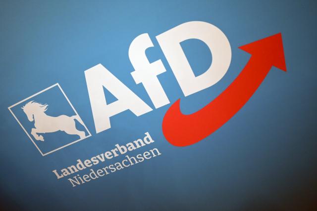 FILED - 21 February 2026, Lower Saxony, Doetlingen: FILE PHOTO - The logo of the Alternative for Germany (AfD) state association of Lower Saxony hangs on a wall in the hall. Photo: Lars Penning/dpa