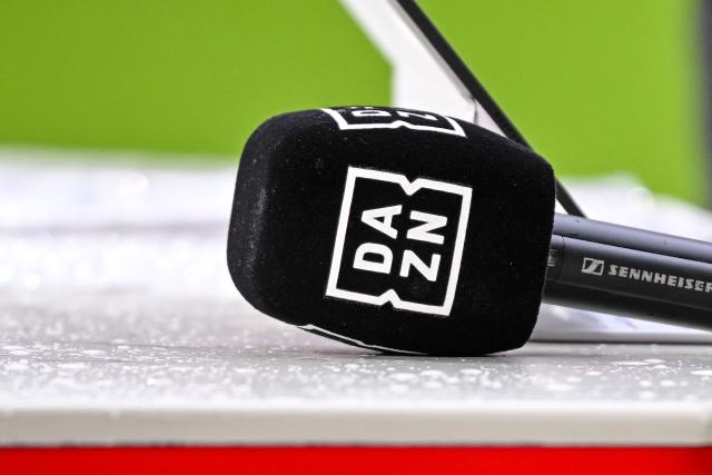 FILED - 21 February 2026, Bavaria, Munich: FILE MATCH - A Microphone with DAZN logo ahead of a soccer match Photo: Harry Langer/dpa