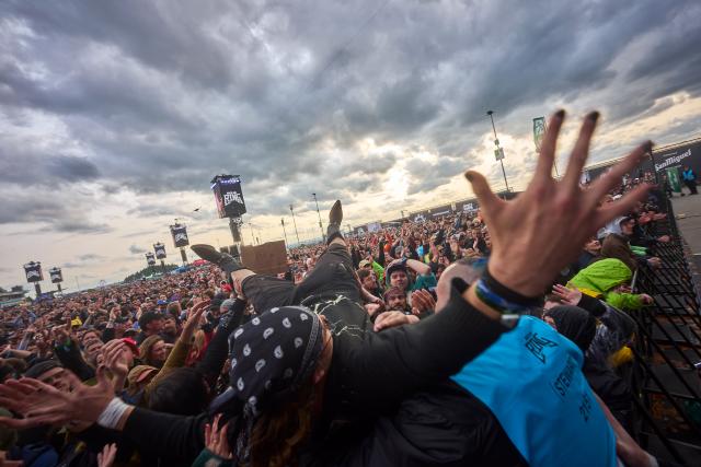 FILED - 08 June 2025, Rhineland-Palatinate, Nuremberg: FILE PHOTO - A visitor is carried by the crowd while crowd-surfing during a performance by the German alternative rock and punk rock band Beatsteaks at the 40th Rock am Ring Festival on the Utopia Stage. Photo: Sascha Ditscher/dpa