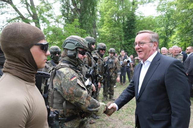 06 June 2026, Saxony-Anhalt, Weissenfels: Boris Pistorius, Germany's Defence Minister, speaks with soldiers from the Rapid Medical Response Force (SES) during Bundeswehr Day. Once a year, the military opens its doors to the public at various locations during the event. Photo: Sebastian Willnow/dpa