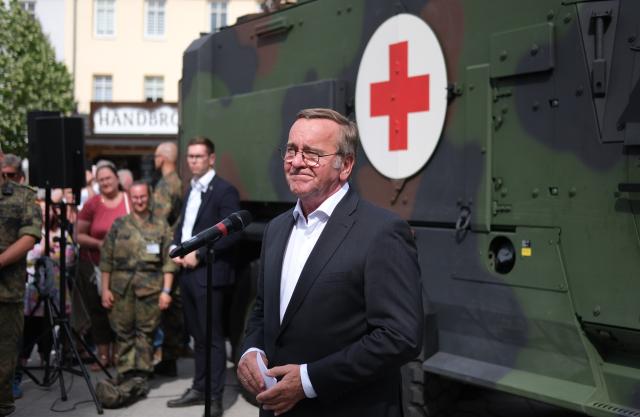 06 June 2026, Saxony-Anhalt, Weissenfels: Boris Pistorius, Germany's Defence Minister, speaks to media representatives alongside soldiers at Bundeswehr Day. At this annual event, the military opens its doors to the public at various locations. Photo: Sebastian Willnow/dpa