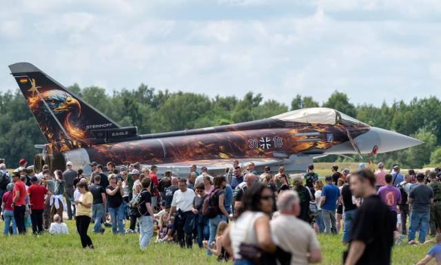 06 June 2026, Mecklenburg-Western Pomerania, Laage: Visitors gather at Laage Air Base, home to the 73rd Tactical Air Force Squadron "Steinhoff," for Armed Forces Day. Photo: Stefan Sauer/dpa
