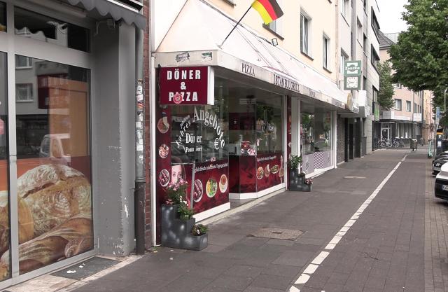 07 June 2026, North Rhine-Westphalia, Cologne: Bullet holes mark the facade of a snack bar, following a nightly shooting, which triggered a large-scale police deployment that involved a helicopter search. Photo: -/dpa