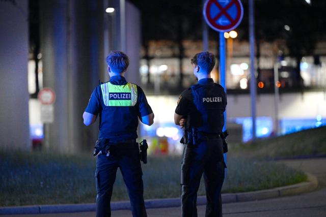 07 June 2026, Bavaria, Munich: Police officers stand in front of the control tower at Munich Airport. Flight operations at Munich Airport have been partially suspended. Photo: Sven Hoppe/dpa