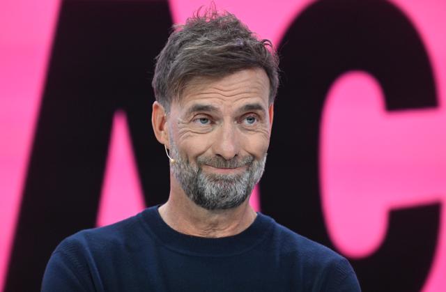 FILED - 23 March 2026, Bavaria, Ismaning: FILE PHOTO - German football manager Juergen Klopp stands on stage at the Telekom press conference for the presentation of the concept for the World Cup. Photo: Felix Hörhager/dpa