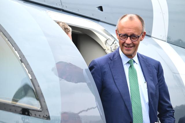 10 June 2026, Brandenburg, Schoenefeld: German Chancellor Friedrich Merz steps out of a Frontex aircraft during a tour of the International Aerospace Exhibition (ILA). Photo: Sebastian Gollnow/dpa