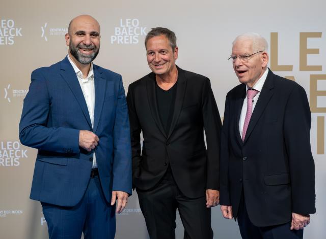 10 June 2026, Berlin: (L-R) German Psychologist and author Ahmad Mansour, comedian Dieter Nuhr and President of the Central Council of Jews in Germany Josef Schuster arrive to attend the Leo Baeck Prize presentation ceremony. Photo: Soeren Stache/dpa