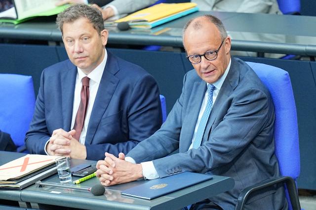 11 June 2026, Berlin: German Chancellor Friedrich Merz (R) sits next to Lars Klingbeil, German Minister of Finance, in the plenary chamber of the Bundestag ahead of the government's policy statement. Photo: Michael Kappeler/dpa
