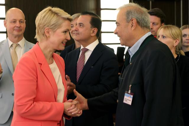 11 June 2026, Mecklenburg-Western Pomerania, Rostock: (L-R) Manuela Schwesig, Minister-President of Mecklenburg-Western Pomerania; Hosams Abu Meri, Minister of Health of Latvia; and Emil Reisinger, former Dean of Rostock University Medical Center, greet one another at the 21st Healthcare Industry Conference. Since 2005, the conference has been organised by the BioCon Valley network on behalf of the state of Mecklenburg-Western Pomerania. Over 600 national and international experts are expected to attend the two-day conference. Photo: Bernd Wüstneck/dpa