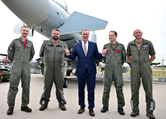 12 June 2026, Brandenburg, Schönefeld: German Minister of Defence Boris Pistorius of the Social Democratic Party (SPD) stands in front of a Eurofighter aircraft with German Air Force soldiers during the International Aerospace Exhibition (ILA) in Berlin. Photo: Sebastian Gollnow/dpa