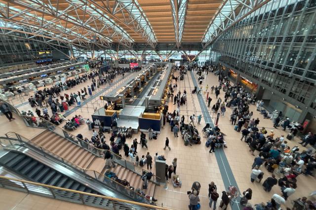 12 June 2026, Hamburg: A large number of people gather in the terminal at Hamburg Airport after the airport's security area was evacuated due to a police incident in Hamburg, Germany. Photo: Frank Molter/dpa