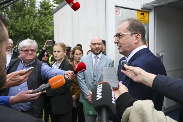 12 June 2026, Brandenburg, Schoenefeld: Alexander Dobrindt, German Minister of the Interior, answers questions from journalists at the opening of the Brandenburg state external border facility at BER Airport. With the reform of the Common European Asylum System (CEAS) taking effect, the external border facility at BER also begins operations today. Photo: Jens Kalaene/dpa