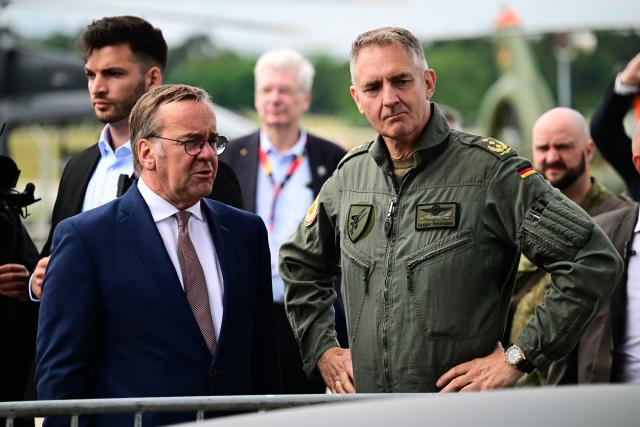 12 June 2026, Brandenburg, Schönefeld: German Minister of Defence Boris Pistorius speaks to Lieutenant General of the German Air Force and 17th Inspector General of the Air Force during the International Aerospace Exhibition (ILA) at the Berlin ExpoCenter Airport. Photo: Sebastian Gollnow/dpa