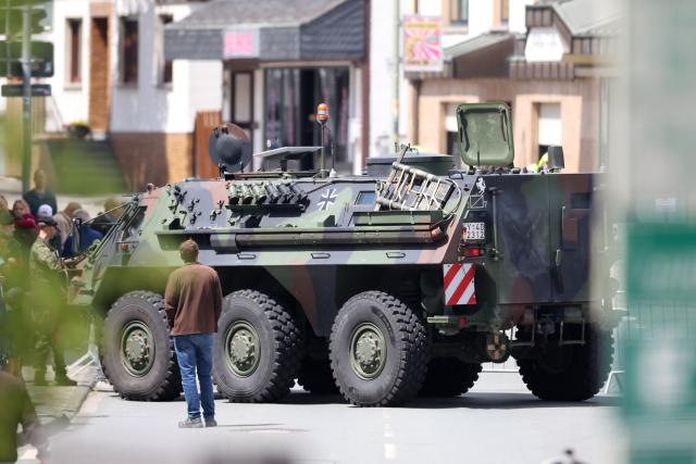 13 June 2026, North Rhine-Westphalia, Medebach: A Fuchs armored personnel carrier is blocking off a street in the city center for the Bundeswehr's ceremonial oath-taking ceremony. Recruits from the 21st Armored Brigade in Ahlen and Unna are taking their oath of service. Photo: Christoph Reichwein/dpa