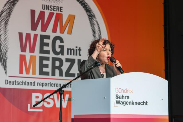 13 June 2026, Saxony-Anhalt, Magdeburg: Amira Mohamed Ali, national chair of BSW, addresses participants at a BSW rally held under the slogan "Merz must go! Against energy rip-offs and the economic crisis" on the station square in the state capital. Photo: Peter Gercke/dpa