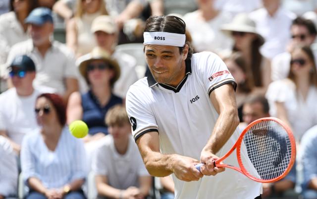 14 June 2026, Baden-Wuerttemberg, Stuttgart: American tennis player Taylor Fritz plays a backhand return against USA's Ben Shelton during their Men's Singles Final tennis match during Day Seven of the Stuttgart Open Tennis Tournament. Photo: Marijan Murat/dpa