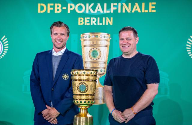 FILED - 22 May 2023, Berlin: FILE PHOTO - Markus Kroesche (L), Chief Sports officer of Eintracht Frankfurt, and Max Eberl, Chief Sports Officer of RB Leipzig, stand next to the trophy during the DFB Cup 2023 Cup Handover at Rotes Rathaus. Photo: Andreas Gora/dpa