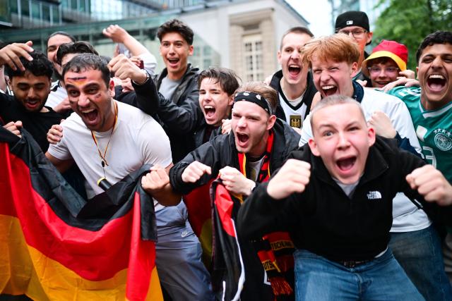 14 June 2026, Berlin: German fans celebrate at the Center am Potsdamer Platz during a public viewing after the 2026 FIFA World Cup Group E soccer match between Germany and Curacao. Photo: Sebastian Gollnow/dpa