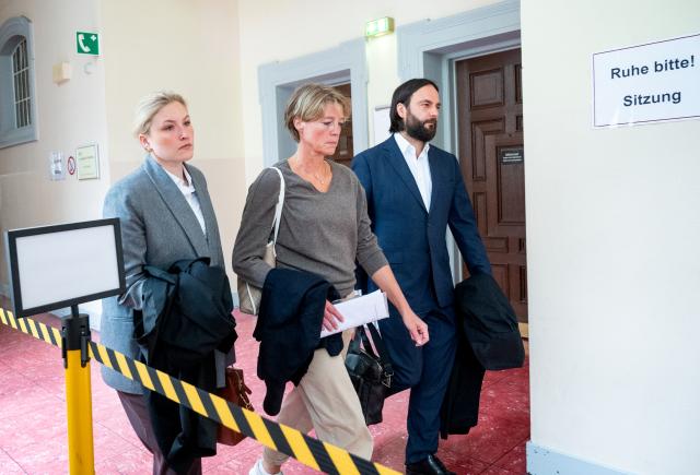15 June 2026, Hamburg: German restaurateur and businesswoman Christina Block, arrives at Hamburg Regional Court for her trial on charges of alleged child abduction, accompanied by her defense attorneys Paula Wlodarek and Ingo Bott. Photo: Daniel Bockwoldt/dpa