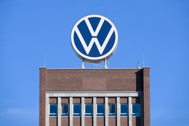 FILED - 07 September 2023, Lower Saxony, Wolfsburg: FILE PHOTO - The Volkswagen logo stands on the brand tower at the main Volkswagen plant. Photo: Julian Stratenschulte/dpa