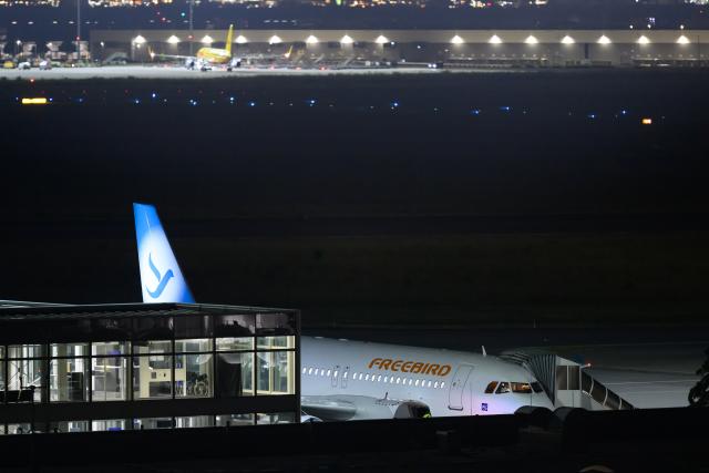 15 June 2026, Saxony, Leipzig: An airplane is parked at Leipzig/Halle Airport after midnight. The plane will take off early in the morning on a deportation flight to Afghanistan. Photo: Hendrik Schmidt/dpa