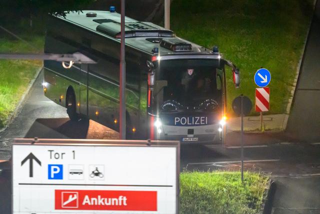 15 June 2026, Saxony, Leipzig: A Federal Police bus is on its way to Leipzig/Halle Airport. A deportation flight to Afghanistan is scheduled to depart from there early this morning. Photo: Hendrik Schmidt/dpa