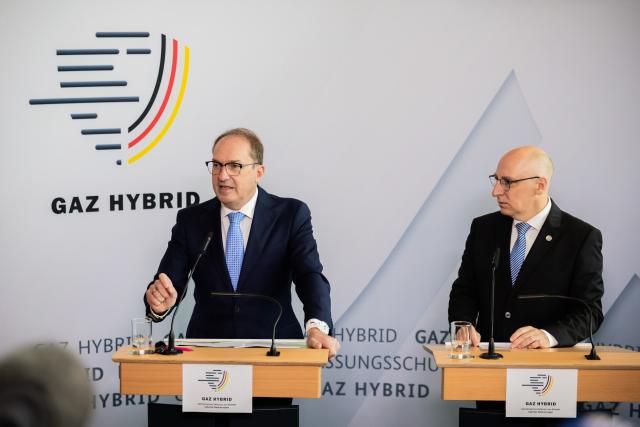 16 June 2026, Berlin: Alexander Dobrindt (L), German Minister of the Interior, and Sinan Selen, President of the Federal Office for the Protection of the Constitution, speak at the inauguration of the Joint Center for Countering Hybrid Threats (GAZ Hybrid). The new defense center will be located on the premises of the Federal Office for the Protection of the Constitution in Berlin-Treptow. Photo: Christoph Soeder/dpa