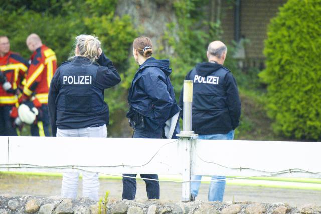 16 June 2026, Schleswig-Holstein, Kropp: Police officers are standing on the street. Earlier this morning, there was an explosion in an apartment here. Photo: Frank Molter/dpa