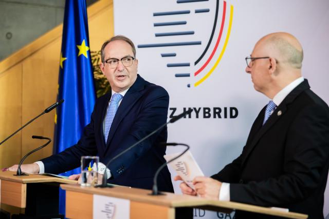 16 June 2026, Berlin: Alexander Dobrindt (L), German Minister of the Interior, and Sinan Selen, President of the Federal Office for the Protection of the Constitution, speak at a press conference during the inauguration of the Joint Center for Countering Hybrid Threats (GAZ Hybrid). The new defense center will be located on the premises of the Federal Office for the Protection of the Constitution in Berlin-Treptow. Photo: Christoph Soeder/dpa