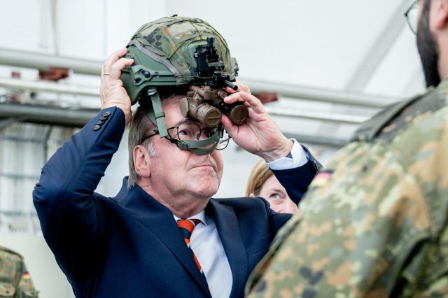 16 June 2026, Lower Saxony, Schortens: German Defense Minister Boris Pistorius dons a helmet equipped with night vision capabilities during a visit to a facility protection regiment at Upjever Air Base to learn about a drone defense system. Photo: Hauke-Christian Dittrich/dpa