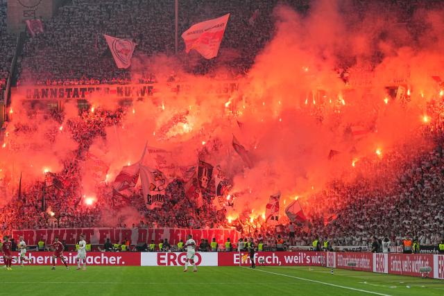 FILED - 23 May 2026, Berlin: FILE PHOTO - Stuttgart fans set off fireworks during the German DFB Cup Final between Bayern Munich and VfB Stuttgart at the Olympic Stadium in Berlin. Photo: Michael Kappeler/dpa
