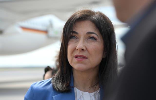 18 June 2026, Brandenburg, Schönefeld: Katherina Reiche, German Minister for Economic Affairs and Energy, makes a statement on the tarmac at Schönefeld Airport before her departure for Turkey. During her two-day trip, the minister will hold political talks in Ankara. The visit is taking place in connection with the meeting of the German-Turkish Economic and Trade Commission and the Energy Forum, as well as bilateral talks on economic, energy, and trade policy issues. Photo: Elisa Schu/dpa