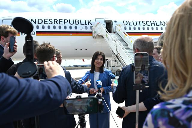18 June 2026, Brandenburg, Schönefeld: Katherina Reiche, German Minister for Economic Affairs and Energy, makes a statement on the tarmac at Schönefeld Airport before her departure for Turkey. During her two-day trip, the minister will hold political talks in Ankara. The visit is taking place in connection with the meeting of the German-Turkish Economic and Trade Commission and the Energy Forum, as well as bilateral talks on economic, energy, and trade policy issues. Photo: Elisa Schu/dpa