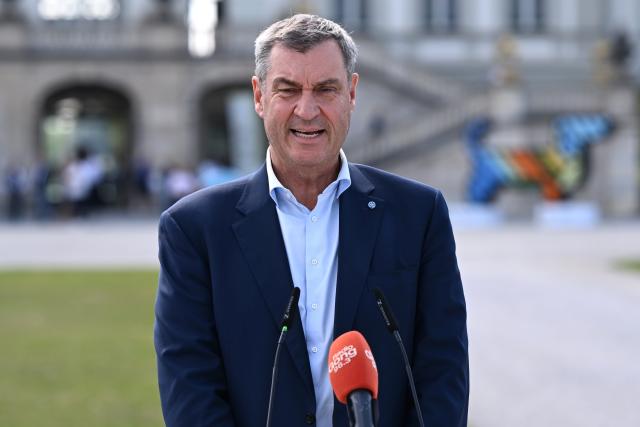 18 June 2026, Bavaria, Munich: Minister President of Bavaria Markus Soeder
attends a press conference in front of Nymphenburg Palace to present to representatives of top sports federations the unique features and opportunities Munich offers as a national candidate for the Summer Olympics, as well as the bid concept. Photo: Sven Hoppe/dpa
