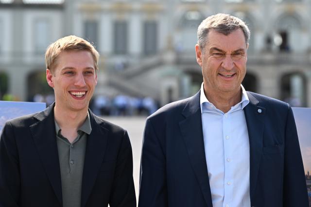 18 June 2026, Bavaria, Munich: Minister President of Bavaria Markus Soeder (R) and Mayor of Munich Dominik Krause attend a press conference in front of Nymphenburg Palace to present to representatives of top sports federations the unique features and opportunities Munich offers as a national candidate for the Summer Olympics, as well as the bid concept. Photo: Sven Hoppe/dpa