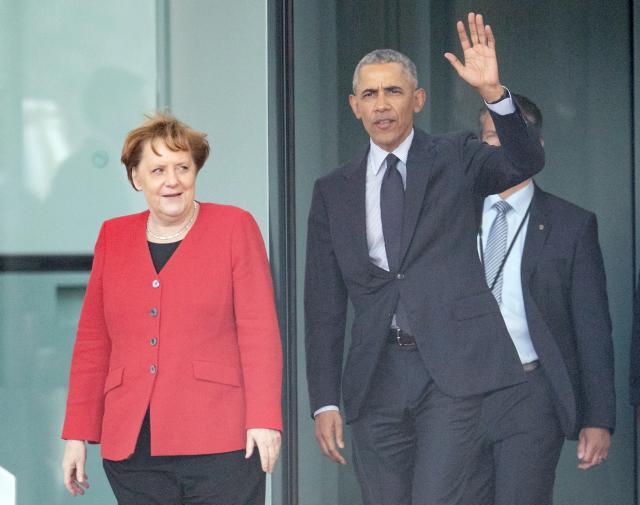 FILED - 05 April 2019, Berlin: FILE PHOTO - German Chancellor Angela Merkel and former US President Barack Obama leaves the Chancellery after their meeting. Photo: Michael Kappeler/dpa