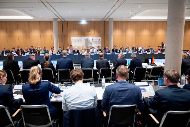 19 June 2026, Hamburg: Participants in the 2026 Conference of Interior Ministers (IMK) are seated together in the hall. Photo: Daniel Bockwoldt/dpa