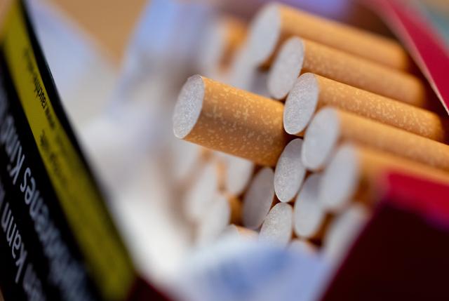 ILLUSTRATION - 06 March 2023, Bavaria, Munich: An open pack of cigarettes lies on a table. Photo: Sven Hoppe/dpa