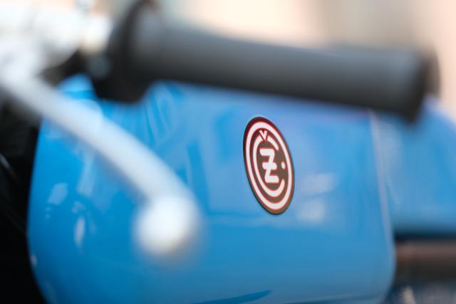 21 June 2026, Saxony, Chemnitz: The CZ logo is seen on a 1963 CZ 250 racing motorcycle as fans of Czech motorcycles gather in Chemnitz for the Jawa meet. Photo: Sebastian Willnow/dpa