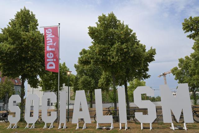 21 June 2026, Brandenburg, Potsdam: The word 'Socialism' is displayed at the conference venue for The Left's federal party convention at the Metropolis Halle in Potsdam. The three-day convention focuses on electing the party's executive committee and debating current political issues. Photo: Michael Bahlo/dpa
