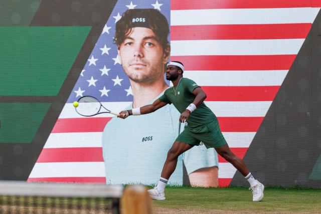21 June 2026, North Rhine-Westphalia, Halle (Westfalen): US tennis player Frances Tiafoe in action against US Taylor Fritz during their men's singles final match of the Halle Open tennis tournament. Photo: Friso Gentsch/dpa