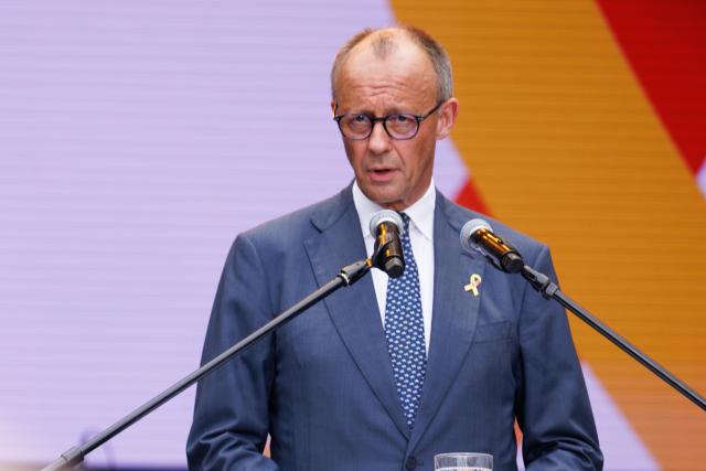 21 June 2026, Berlin: German Chancellor Friedrich Merz speaks during the ceremony marking the 2nd National Veterans Day. Germany is celebrating the 2nd National Veterans Day with a large ceremony around the Reichstag building. Photo: Carsten Koall/dpa